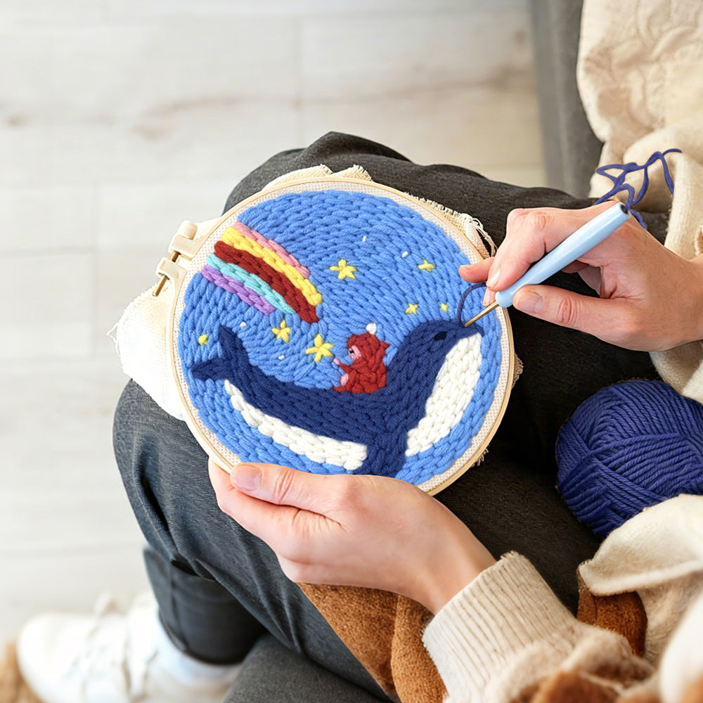 Creating handmade whale riding astronaut with rainbow sky punch needle artwork
