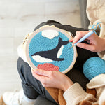 Creating handmade whale swimming under the sea punch needle artwork