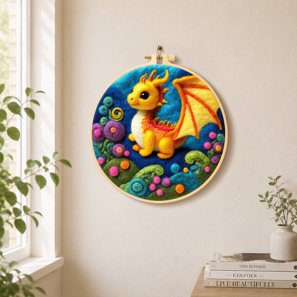 Whimsical baby dragon and colourful spiral plant needle felt wall art displayed in a bright home interior