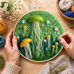 Creating the whimsical green and yellow jellyfish wool painting by hand with a felting needle
