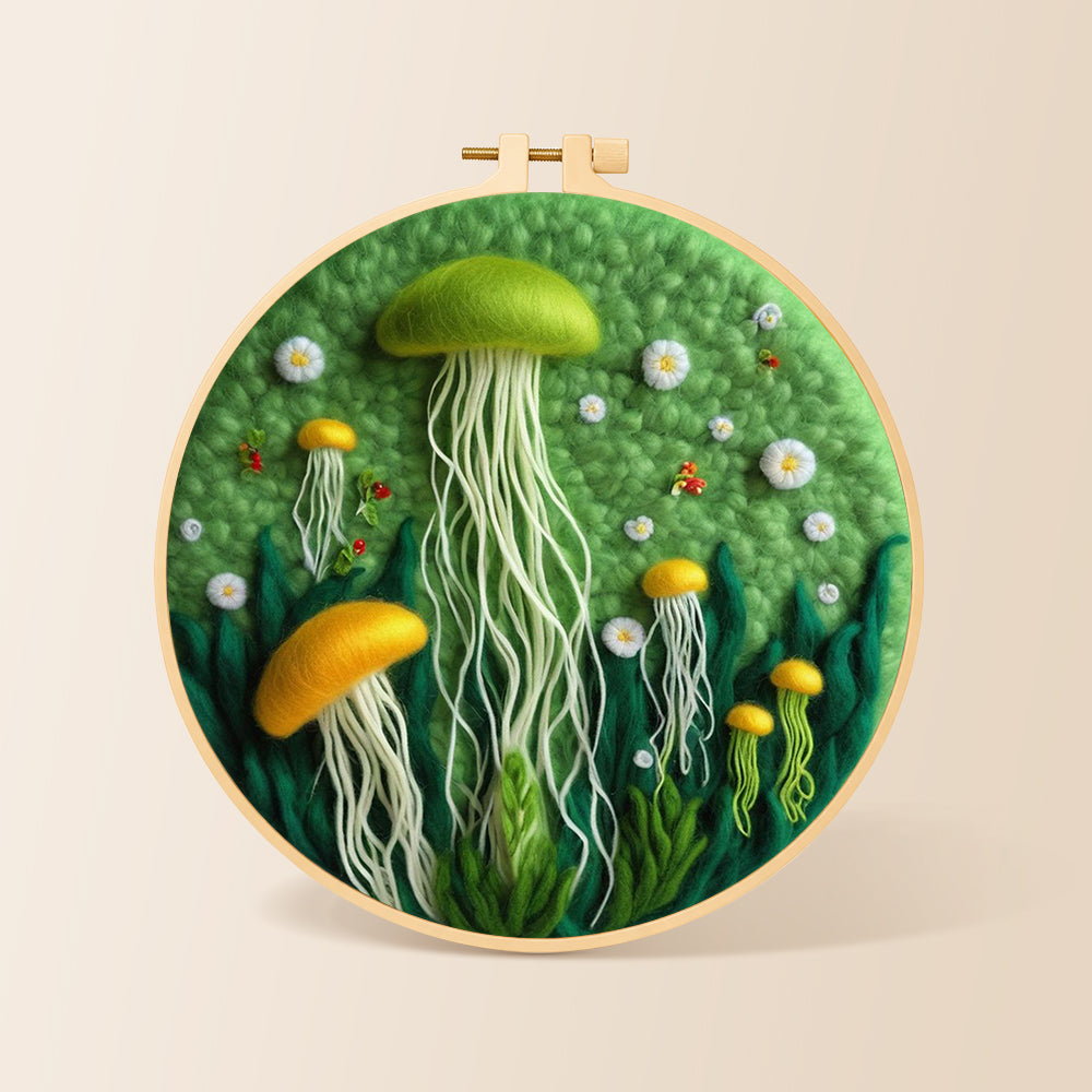 Whimsical green and yellow jellyfish needle felting kit for beginners with a round wooden frame