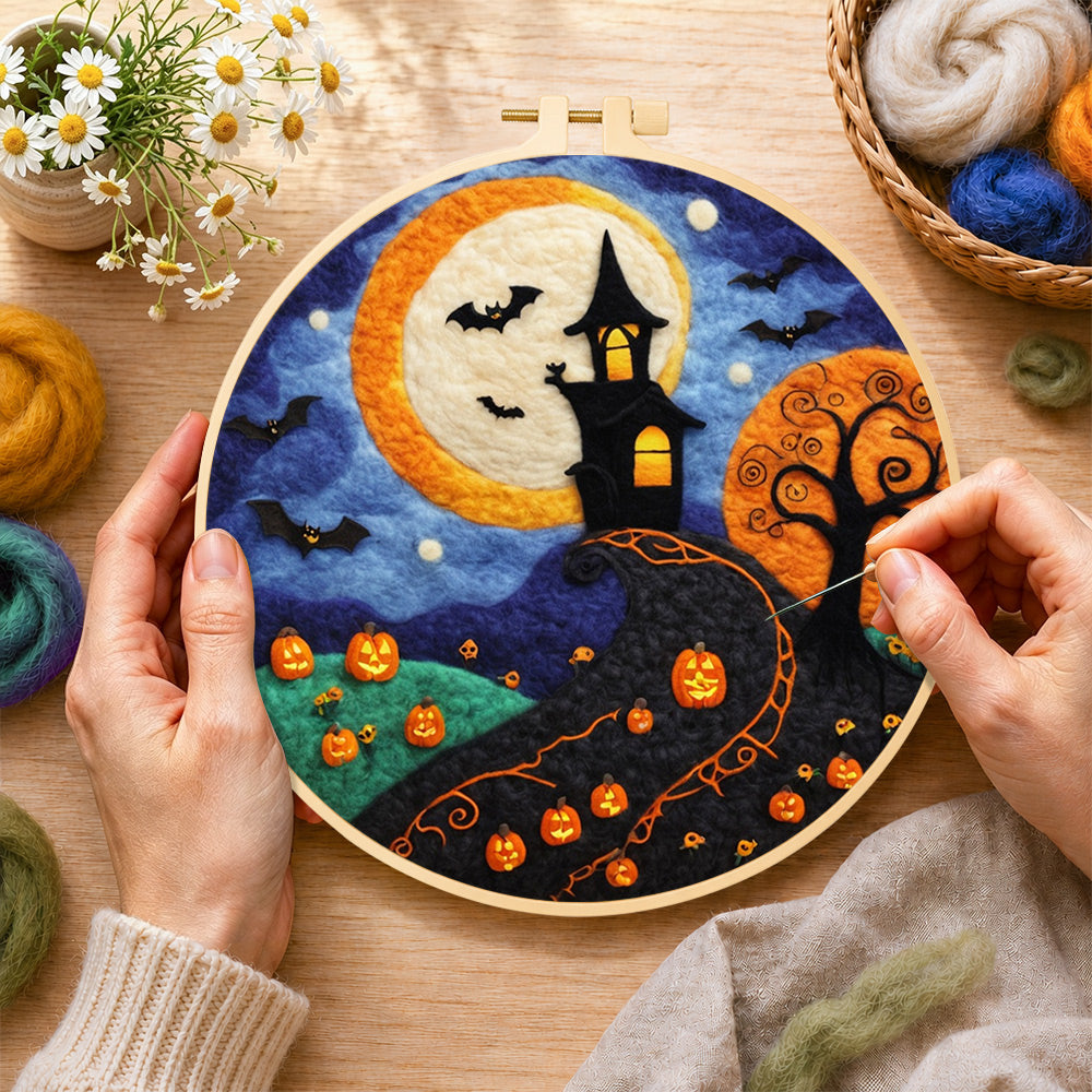 Creating the whimsical haunted village and halloween pumpkins wool painting by hand with a felting needle