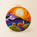 Whimsical mountains and moon needle felting kit for beginners with a round wooden frame