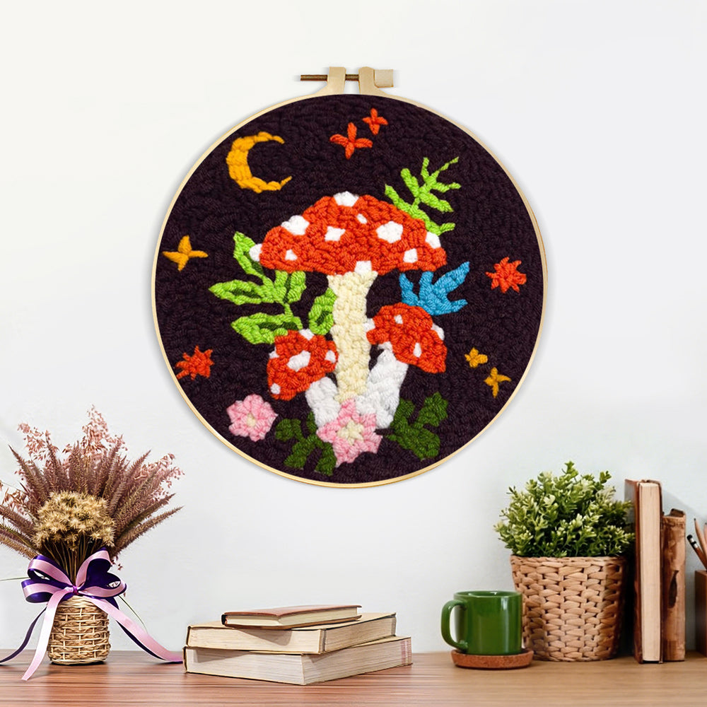 Finished whimsical mushroom artwork displayed on a wall