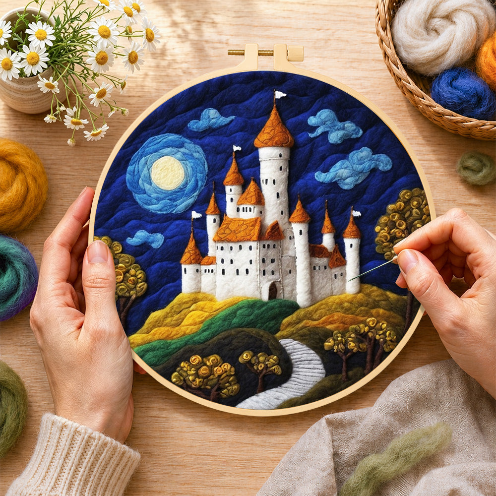 Creating the whimsical white castle and blue moon wool painting by hand with a felting needle