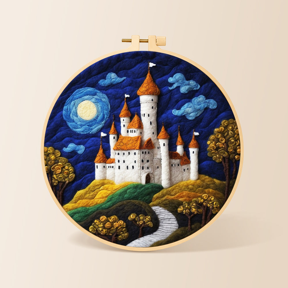 Whimsical white castle and blue moon needle felting kit for beginners with a round wooden frame