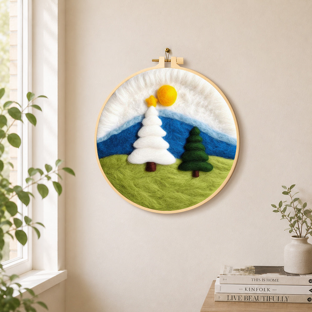 White and green christmas trees on grass needle felt wall art displayed in a bright home interior