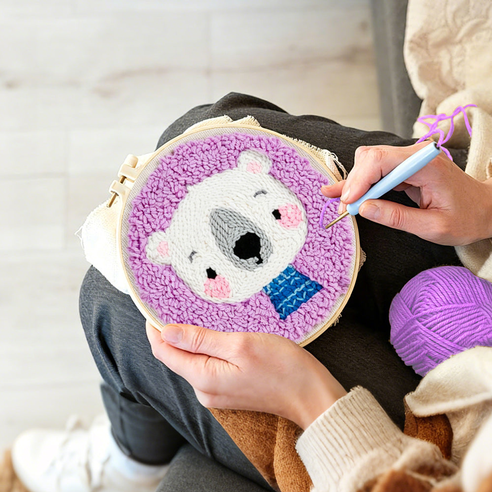 Creating handmade white bear in purple background punch needle artwork
