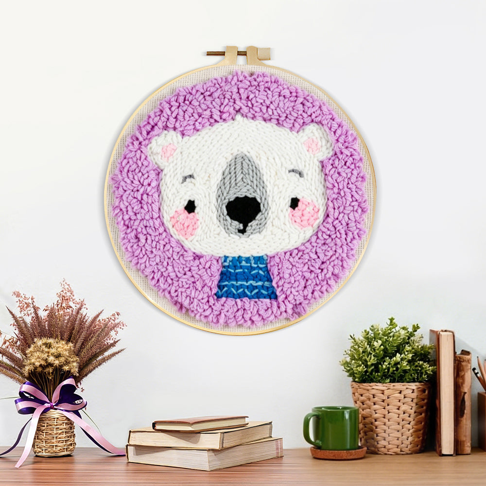 Finished white bear in purple background artwork displayed on a wall
