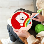 Creating handmade white bear with rainbow punch needle artwork