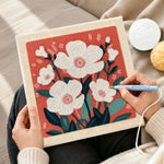 Creating handmade white blossoms punch needle artwork