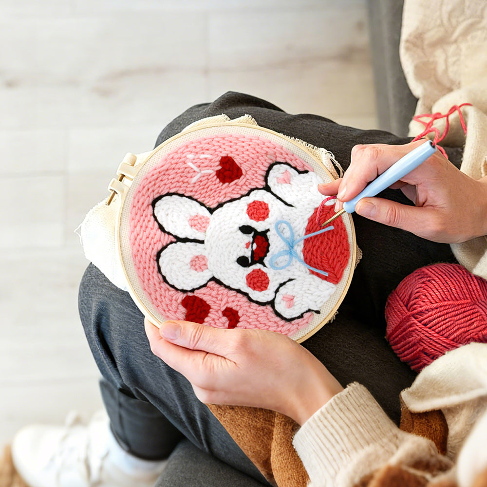 Creating handmade white bunny with hearts punch needle artwork