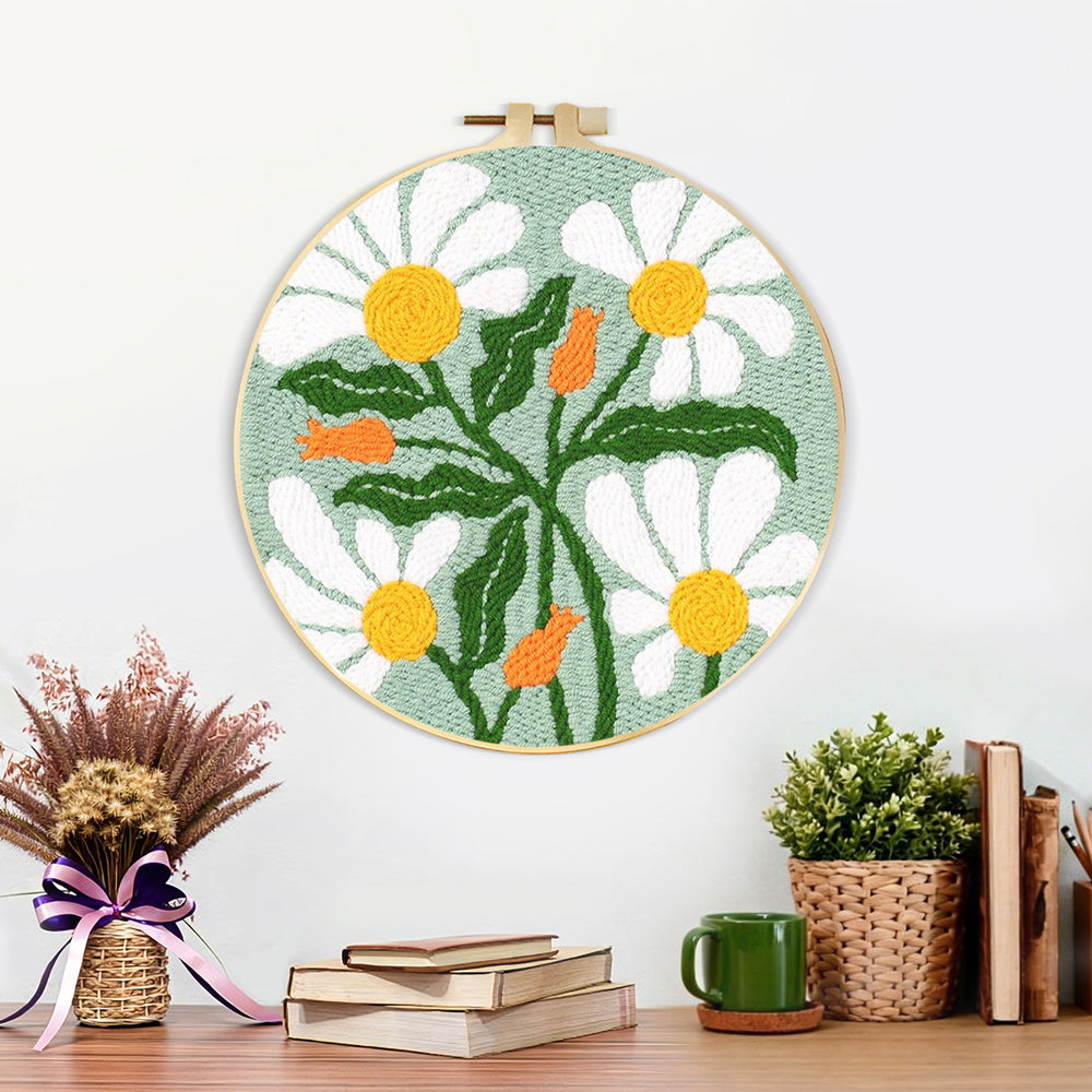 Finished white chamomile artwork displayed on a wall