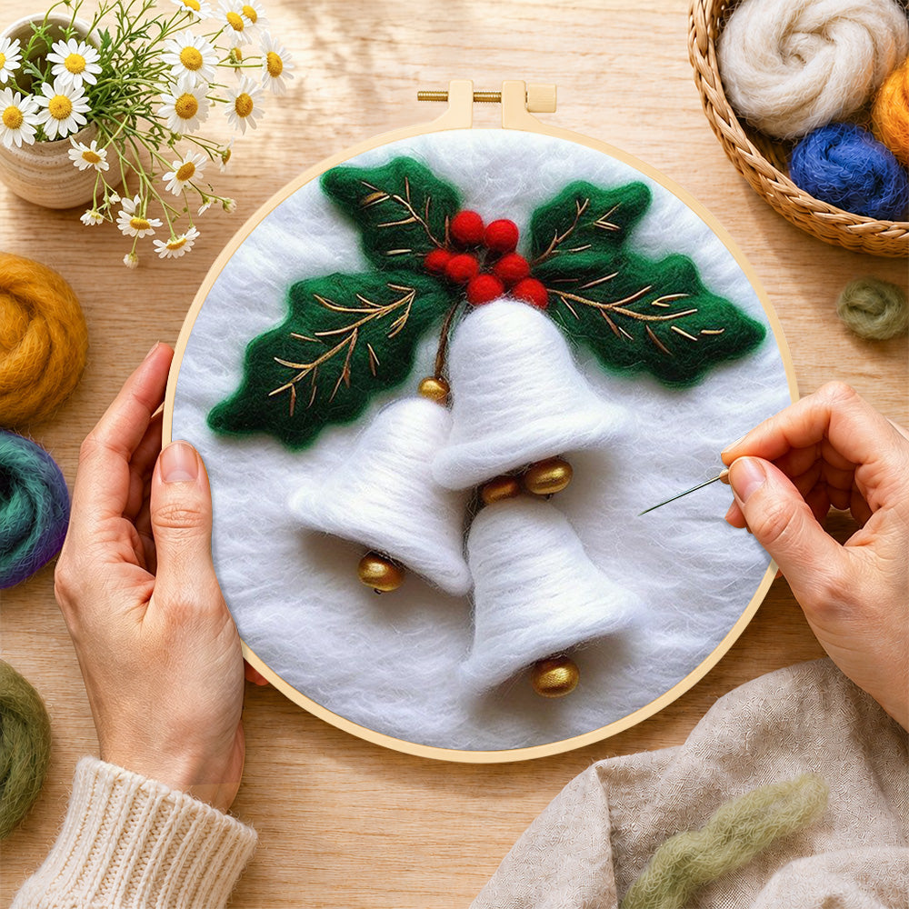 Creating the white christmas bells with holly wool painting by hand with a felting needle