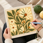 Creating handmade white daisies and berries punch needle artwork