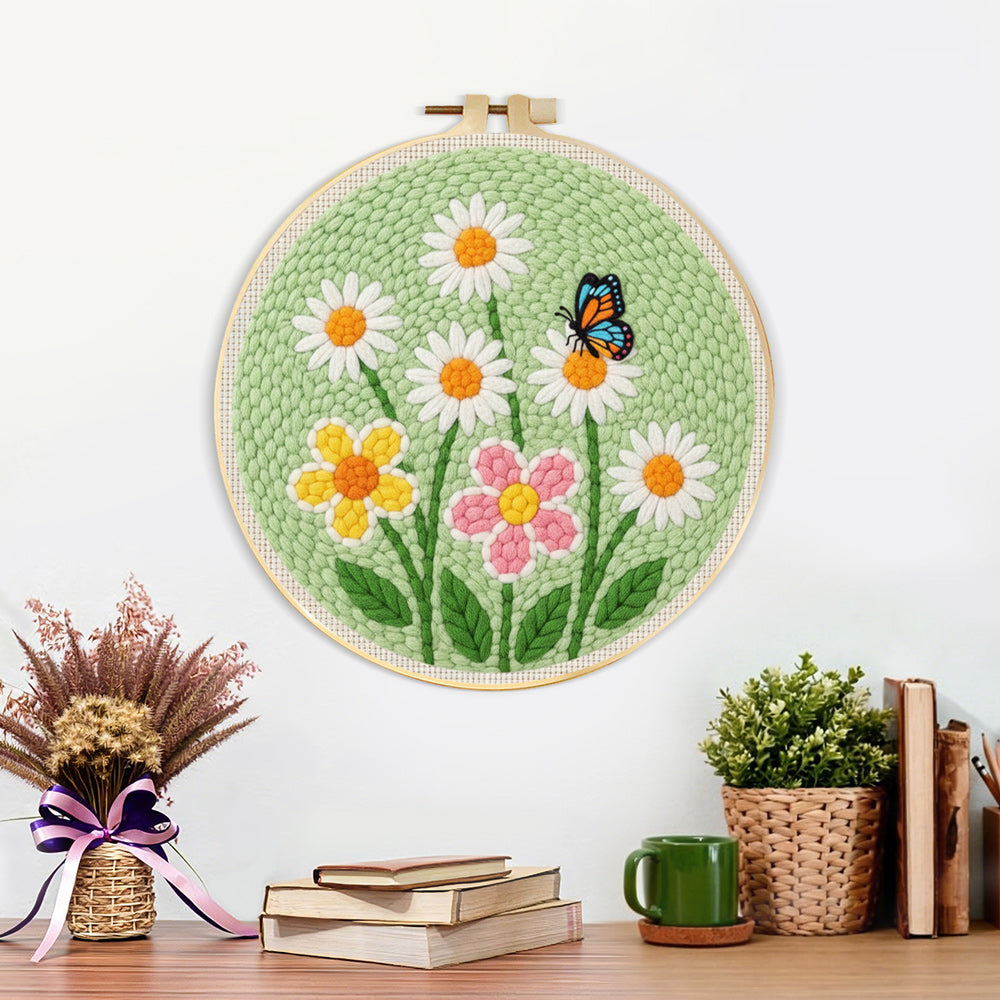 Finished white daisies and butterfly artwork displayed on a wall