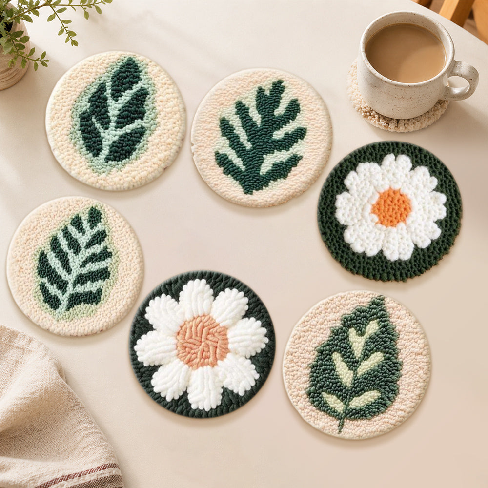 White daisies and green leaves punch needle coasters used for home decoration