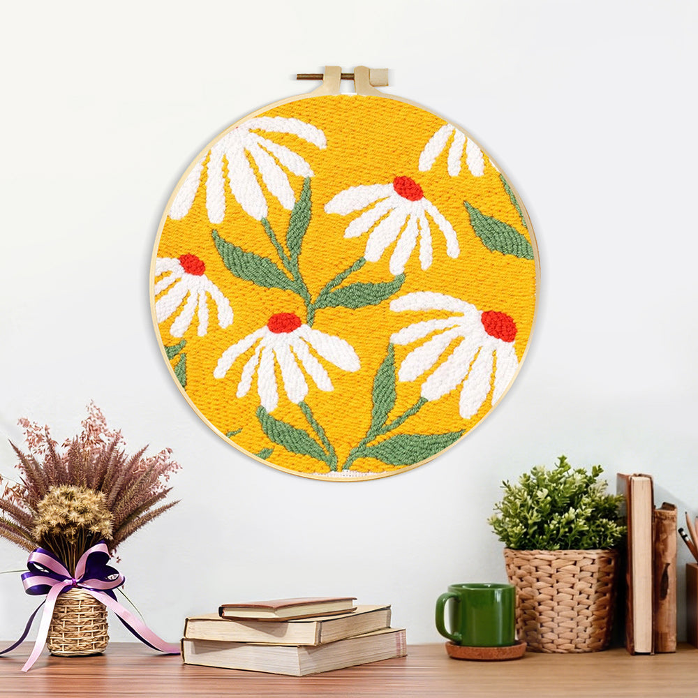 Finished white daisies on a yellow background artwork displayed on a wall
