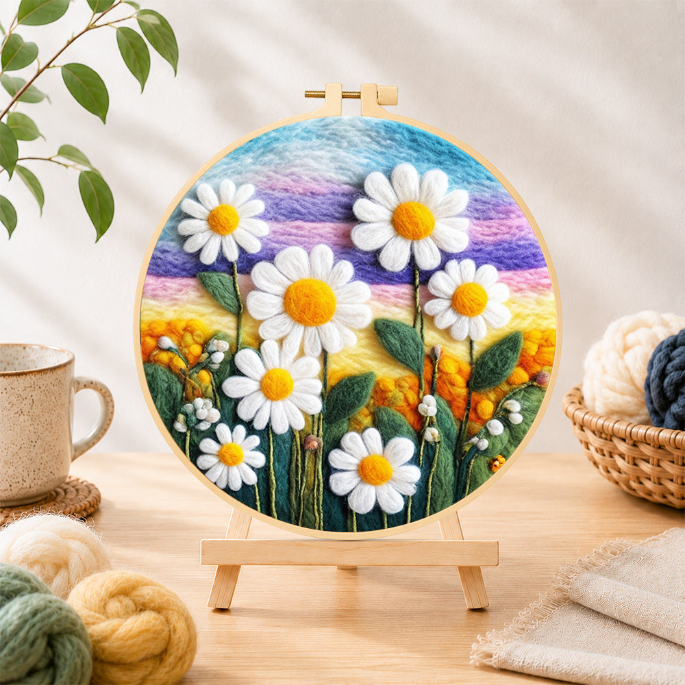 Finished white daisies on rainbow background needle felting displayed on a wooden easel