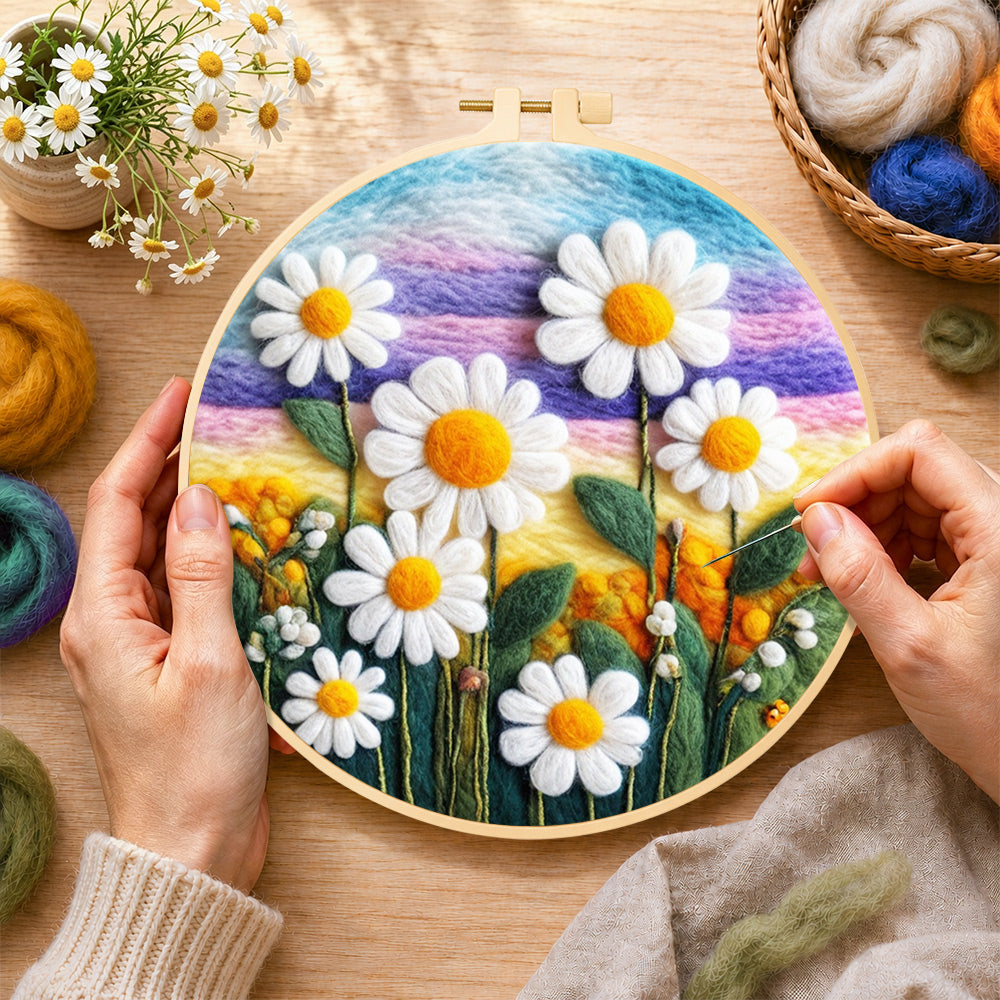 Creating the white daisies on rainbow background wool painting by hand with a felting needle