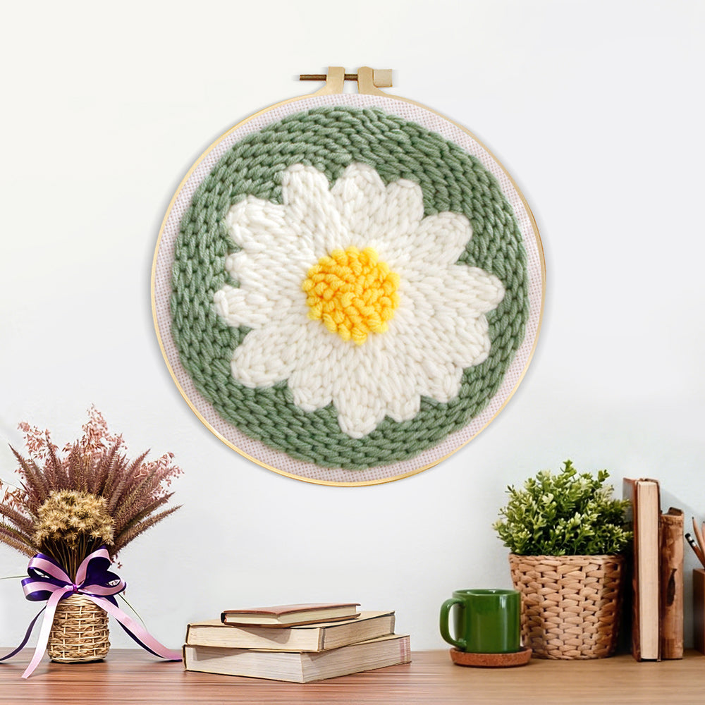 Finished white daisy flower artwork displayed on a wall