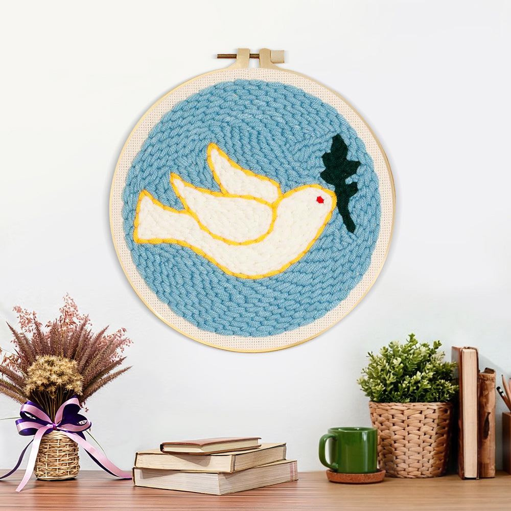 Finished white dove and olive leaf artwork displayed on a wall