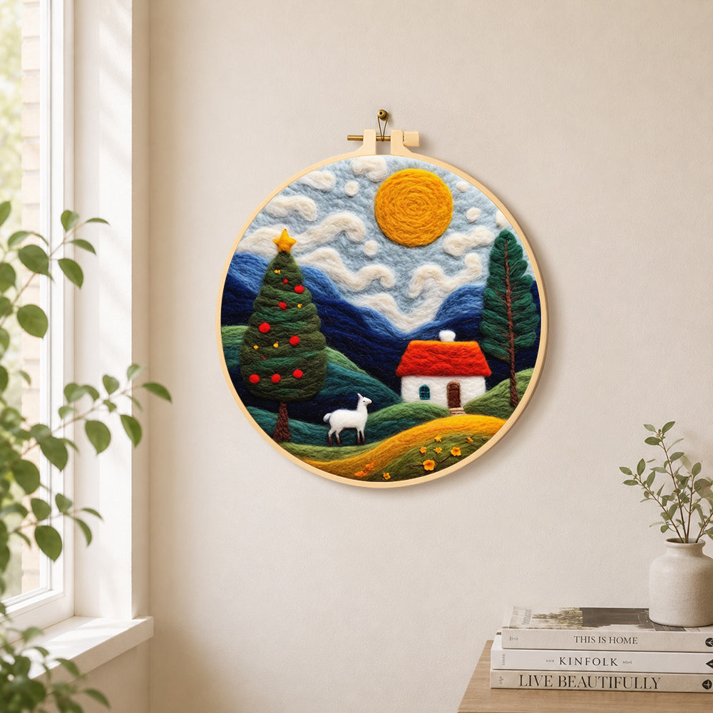 White goat and christmas tree in the hills needle felt wall art displayed in a bright home interior