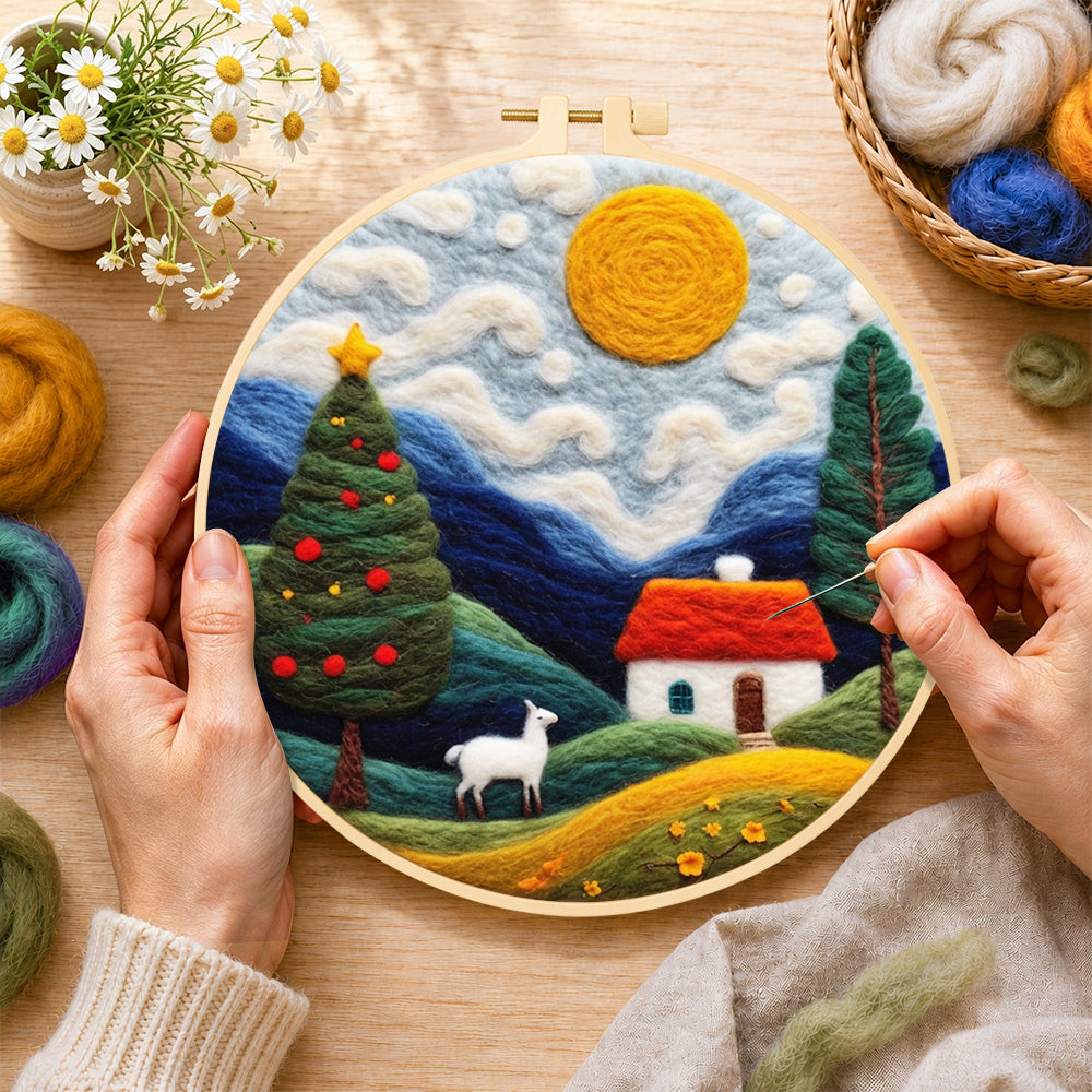 Creating the white goat and christmas tree in the hills wool painting by hand with a felting needle