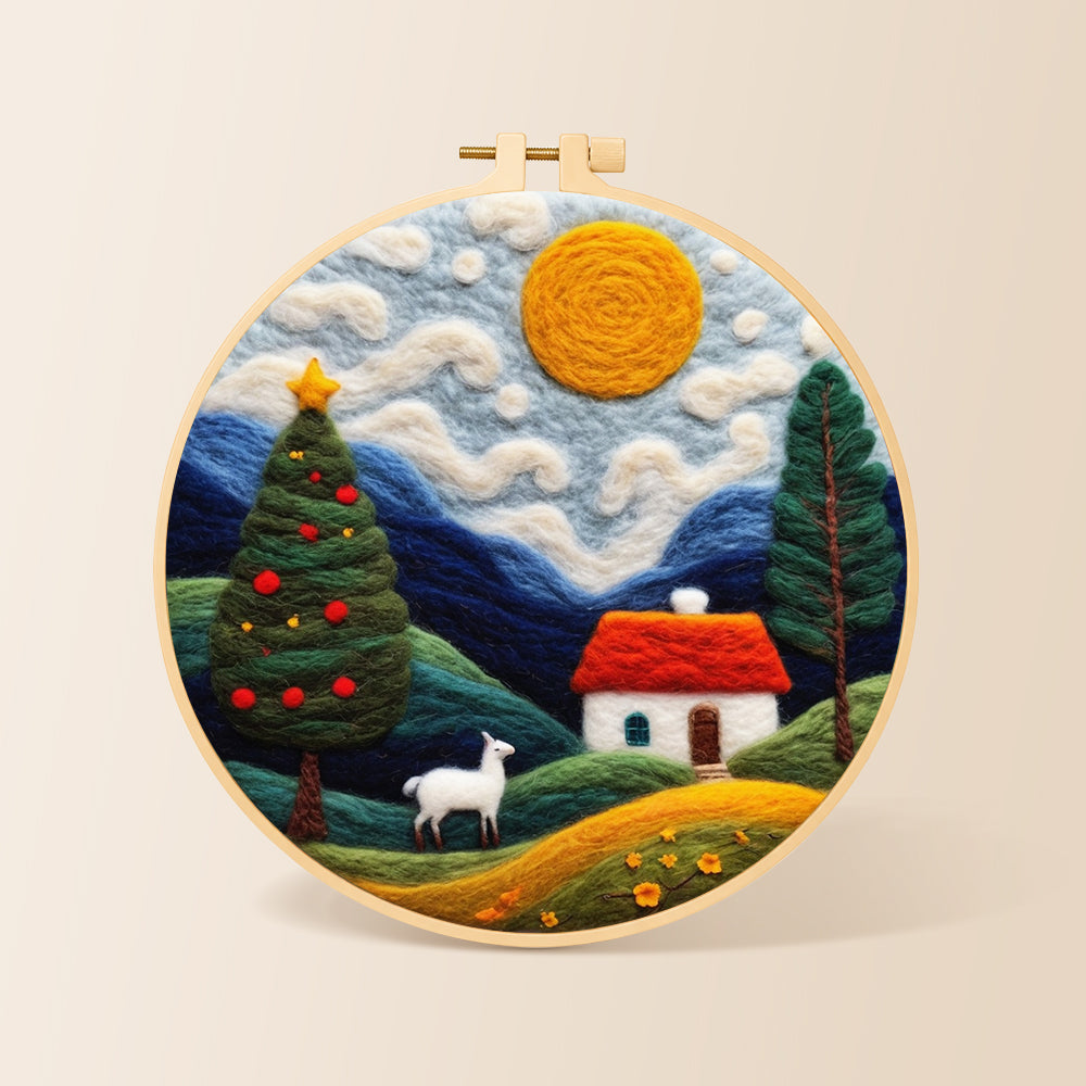 White goat and christmas tree in the hills needle felting kit for beginners with a round wooden frame