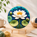Finished white lotus with lily pads needle felting displayed on a wooden easel
