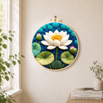 White lotus with lily pads needle felt wall art displayed in a bright home interior