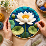 Creating the white lotus with lily pads wool painting by hand with a felting needle