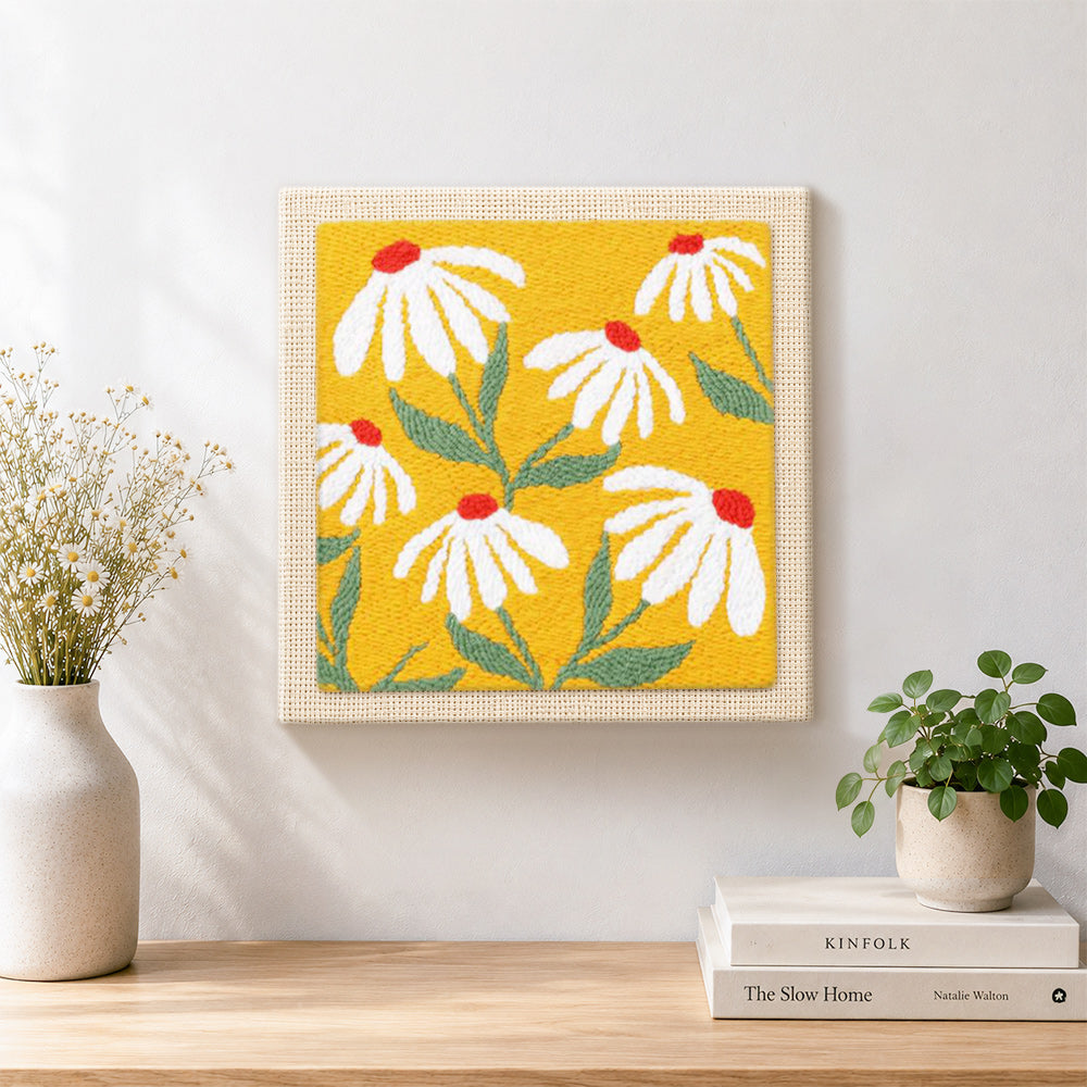 Finished white petals with red centres artwork displayed on a wall
