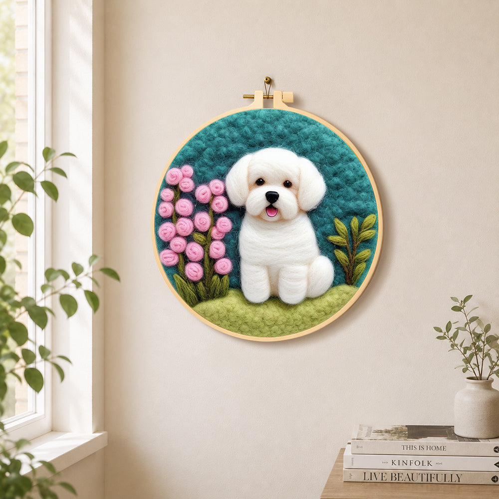 White puppy with pink flowers needle felt wall art displayed in a bright home interior