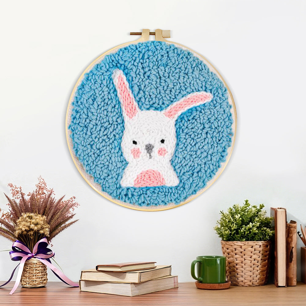 Finished white rabbit with upright ears artwork displayed on a wall