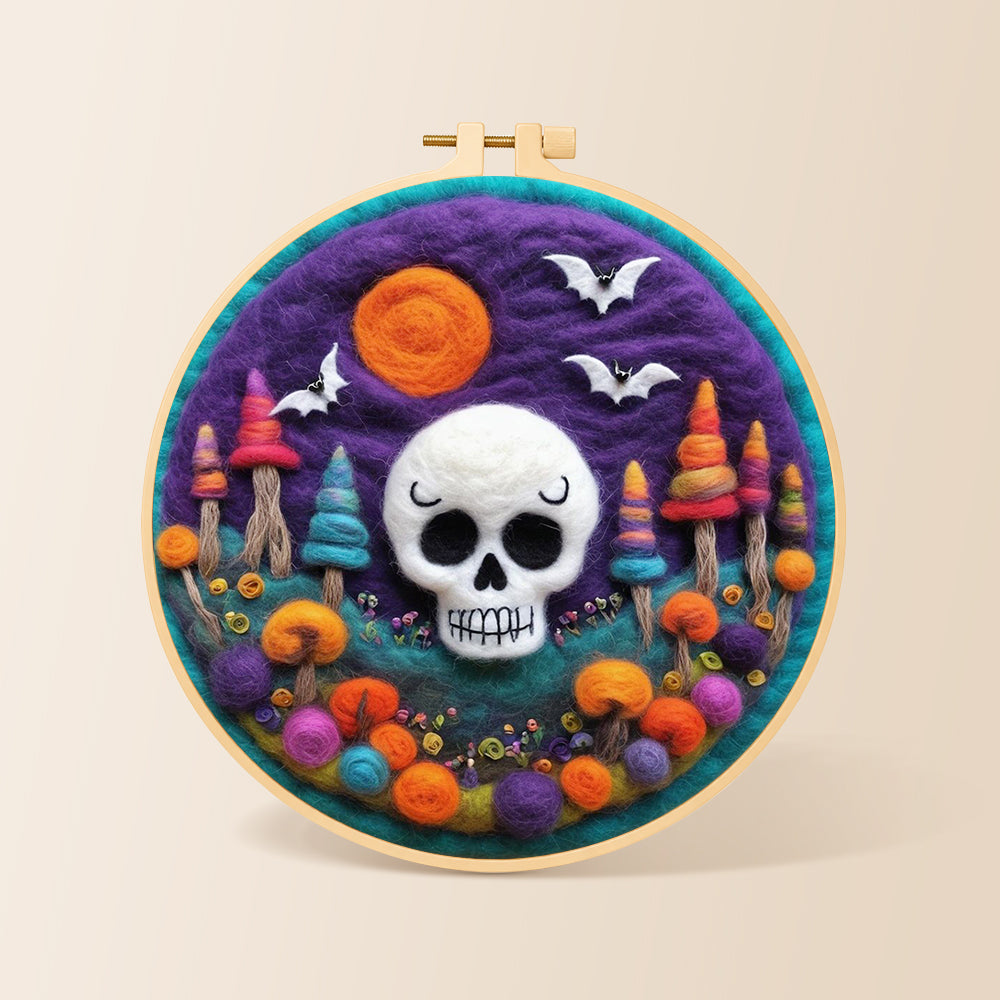 White skull with colourful mushroom trees needle felting kit for beginners with a round wooden frame