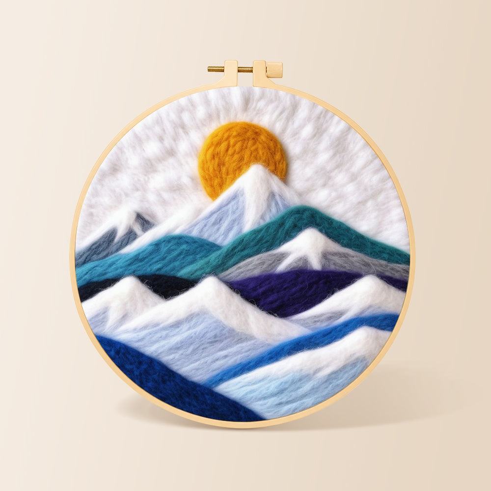 White snow mountains and golden spiral sun needle felting kit for beginners with a round wooden frame