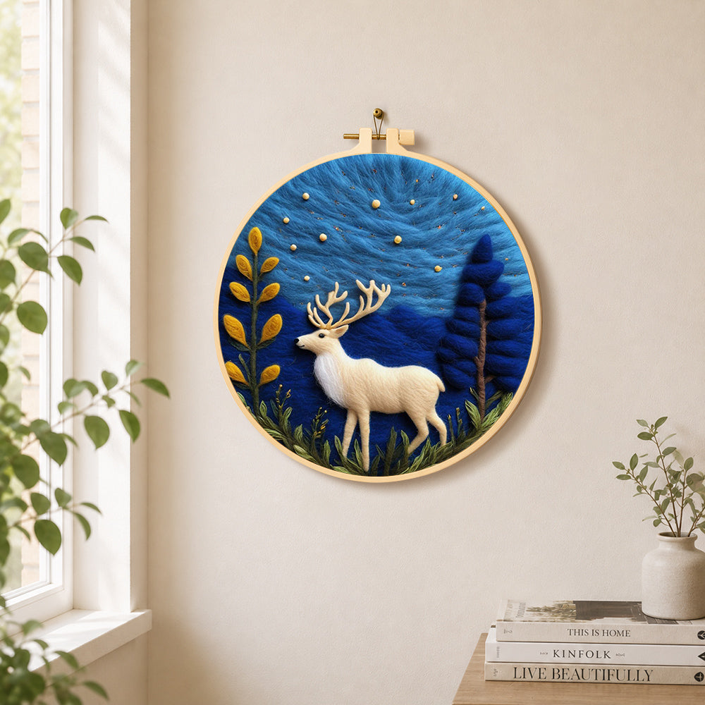 White strolling deer needle felt wall art displayed in a bright home interior
