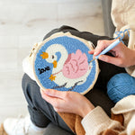 Creating handmade white swan with pink wings punch needle artwork