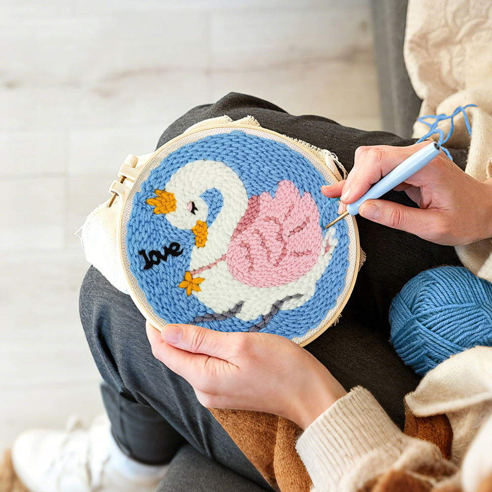 Creating handmade white swan with pink wings punch needle artwork