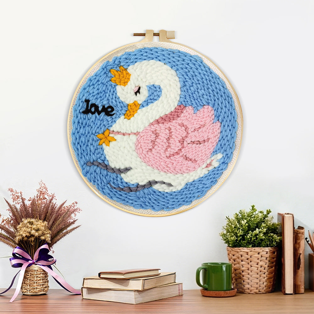 Finished white swan with pink wings artwork displayed on a wall