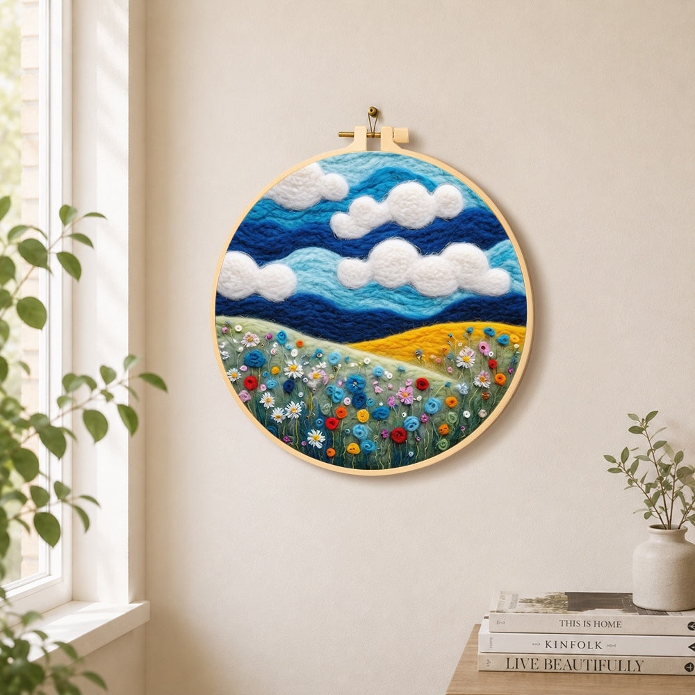 Wildflowers under the vibrant blue sky needle felt wall art displayed in a bright home interior