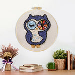 Finished winking owl artwork displayed on a wall