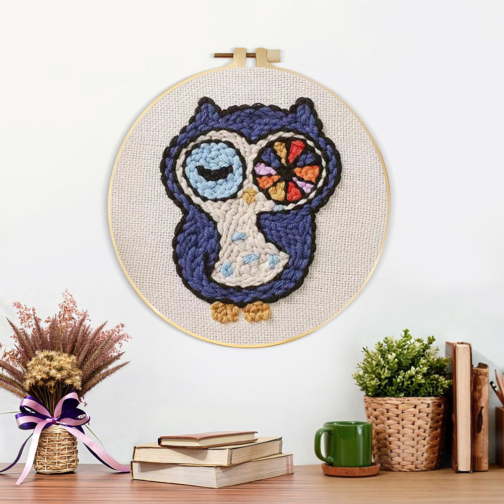 Finished winking owl artwork displayed on a wall