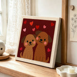 Winking puppy couple punch needle artwork displayed on a table