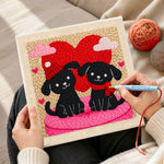 Creating handmade winter black puppies with red heart punch needle artwork