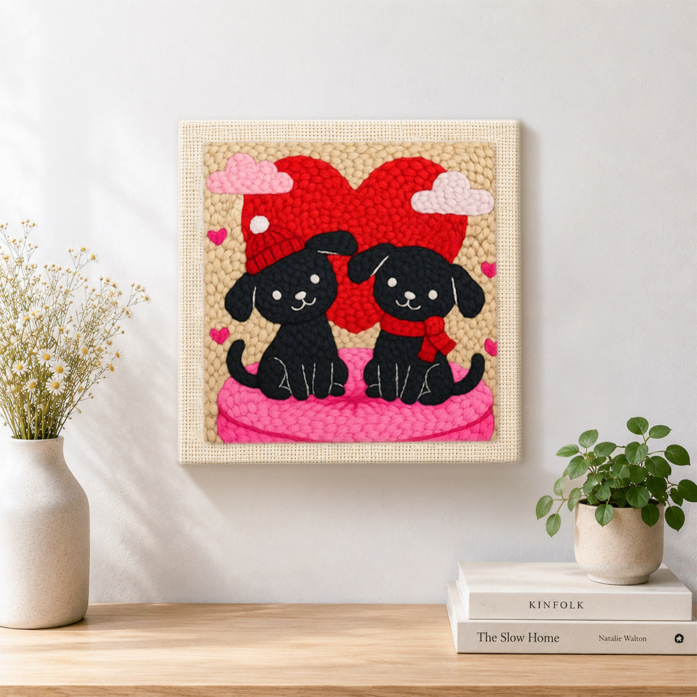 Finished winter black puppies with red heart artwork displayed on a wall