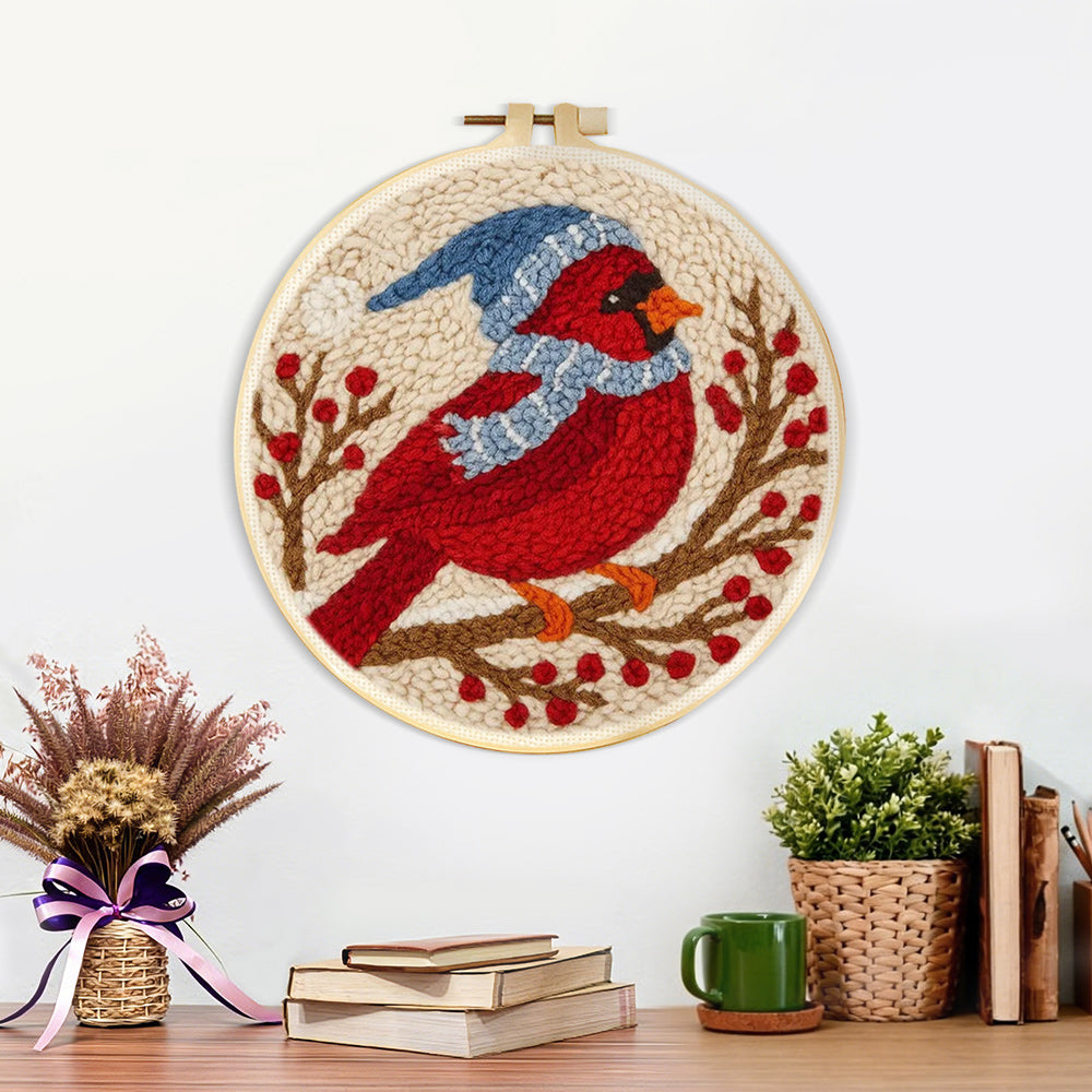 Finished winter cardinal on the berry branch artwork displayed on a wall