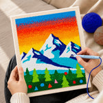 Creating handmade winter mountains and pine forest punch needle artwork