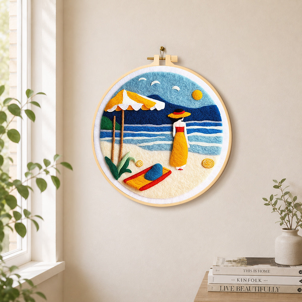 Woman and parasol on the beach needle felt wall art displayed in a bright home interior
